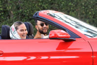 <p>John Legend and Chrissy Teigen were spotted riding around Beverly Hills with their dog in a red convertible. </p>