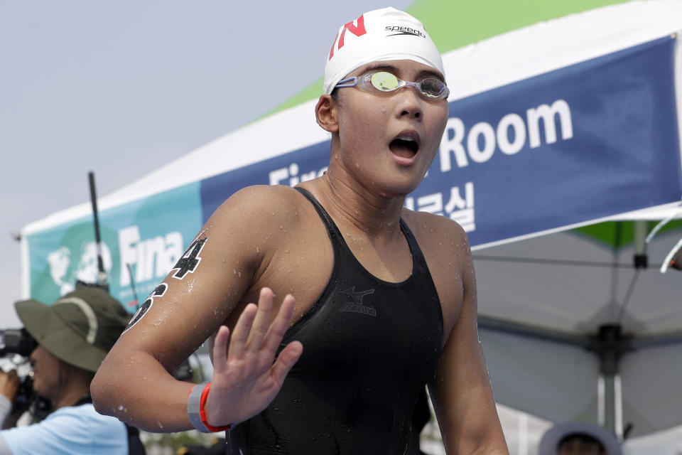 Xin Xin of China reacts after competing in the women's 10km open water swim at the World Swimming Championships in Yeosu, South Korea, Sunday, July 14, 2019. (AP Photo/Mark Schiefelbein)