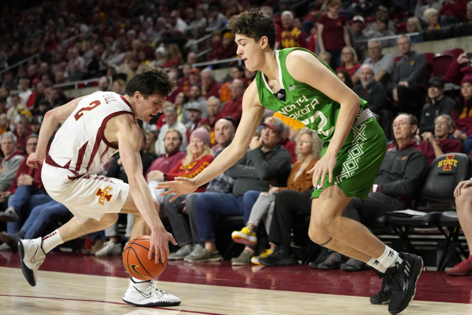 Iowa State guard Caleb Grill (2) steals the ball from North Dakota guard Treysen Eaglestaff (52) during the second half of an NCAA college basketball game, Wednesday, Nov. 30, 2022, in Ames, Iowa. Iowa State won 63-44. (AP Photo/Charlie Neibergall)