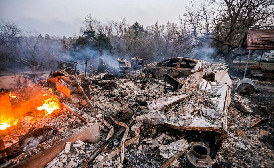 The home of Margie Clark is pictured Friday after a wildfire in the Guthrie area.