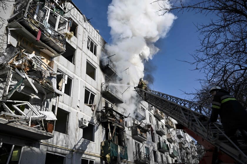 Firefighters work on a fire on a building after bombings on the eastern Ukraine town of Chuguiv on February 24, 2022, as Russian armed forces are trying to invade Ukraine from several directions, using rocket systems and helicopters to attack Ukrainian position in the south, the border guard service said. - Russia's ground forces on Thursday crossed into Ukraine from several directions, Ukraine's border guard service said, hours after President Vladimir Putin announced the launch of a major offensive. Russian tanks and other heavy equipment crossed the frontier in several northern regions, as well as from the Kremlin-annexed peninsula of Crimea in the south, the agency said. (Photo by Aris Messinis / AFP) (Photo by ARIS MESSINIS/AFP via Getty Images)