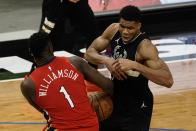 New Orleans Pelicans' Zion Williamson steals the ball from Milwaukee Bucks' Giannis Antetokounmpo during the second half of an NBA basketball game Thursday, Feb. 25, 2021, in Milwaukee. (AP Photo/Morry Gash)