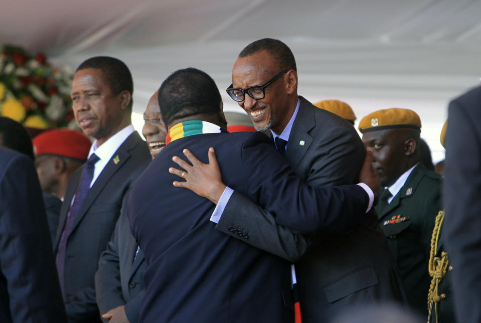 Zimbabwean President Emmerson Mnangagwa, left, greets Rwanda President Paul Kagame, during his inauguration ceremony at the National Sports Stadium in Harare, Sunday, Aug. 26, 2018. The Constitutional Court upheld Mnangagwa's narrow election win Friday, saying the opposition did not provide " sufficient and credible evidence" to back vote- rigging claims.(AP Photo/Tsvangirayi Mukwazhi)