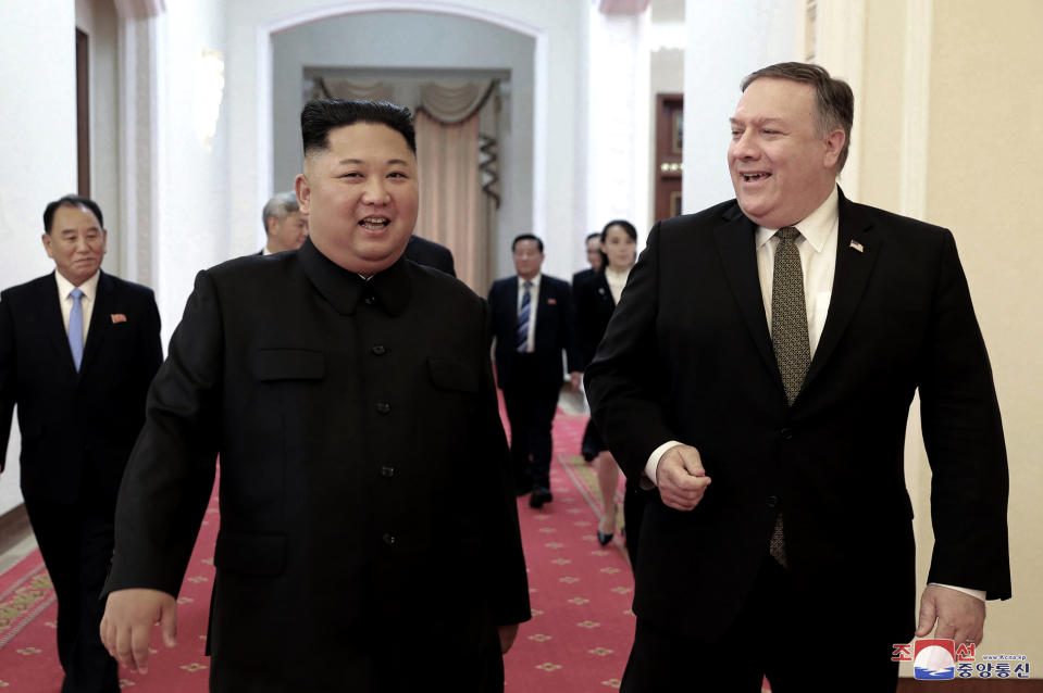 FILE - In this Oct. 7, 2018, file photo provided by the North Korean government, North Korean leader Kim Jong Un, center left, and U.S. Secretary of State Mike Pompeo walk together before their meeting in Pyongyang, North Korea. North Korea said Thursday, April 18, 2019, that it had test-fired a new type of "tactical guided weapon," its first such test in nearly half a year, and demanded that Washington remove Pompeo from nuclear negotiations. Korean language watermark on image as provided by source reads: "KCNA" which is the abbreviation for Korean Central News Agency. (Korean Central News Agency/Korea News Service via AP, File)