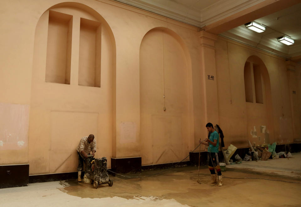 In this Wednesday, Oct. 30, 2013 photo, laborer workers renovate a hall in the Egyptian Museum near Tahrir Square in Cairo, Egypt. The 111-year-old museum, a treasure trove of pharaonic antiquities, has long been one of the centerpieces of tourism to Egypt. But the constant instability since the 2011 uprising that toppled autocrat Hosni Mubarak has dried up tourism to the country, slashing a key source of revenue. Moreover, political backbiting and attempts to stop corruption have had a knock-on effect of bringing a de facto ban on sending antiquities on tours to museums abroad, cutting off what was once a major source of funding for the museum. (AP Photo/Nariman El-Mofty)