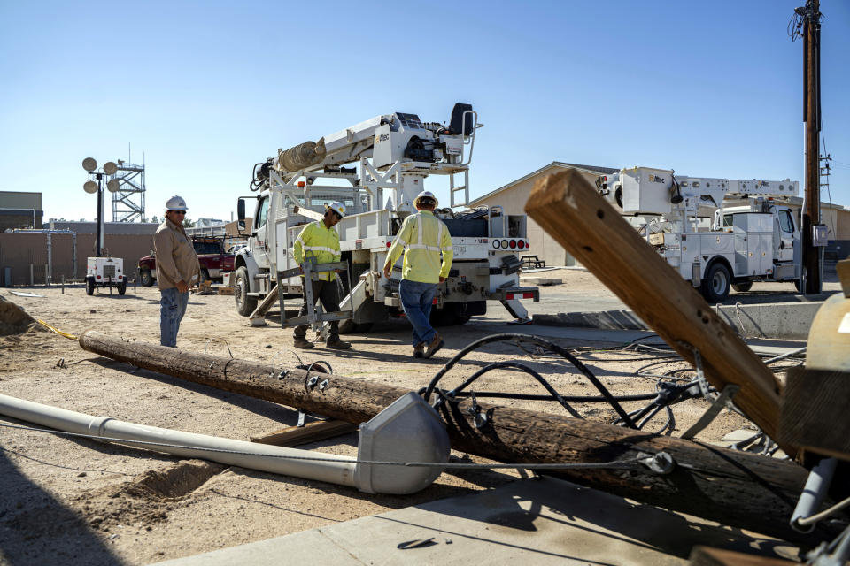 In this July 10, 2019 photo provided by the U.S. Navy, civilian workers assigned to Naval Air Weapons Station China Lake repair damaged base infrastructure after multiple earthquakes occurred July 4 and 5 at the base, nearby Ridgecrest and a wide area of Southern California. The base sustained heavy damage that experts estimate will cost over $5 billion to repair. (Mass Communication Specialist 1st Class Arthurgwain L. Marquez/U.S. Navy via AP)