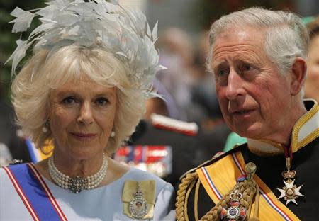 Britain's Prince Charles (R) and his wife Camilla, Duchess of Cornwall, attend a religious ceremony at the Nieuwe Kerk church in Amsterdam April 30, 2013. REUTERS/Peter Dejong/Pool