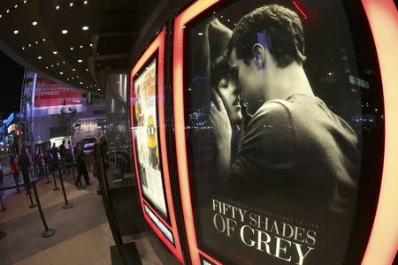 A film poster for "Fifty Shades of Grey" is pictured at Regal Theater in Los Angeles, California, February 12, 2015. REUTERS/Jonathan Alcorn