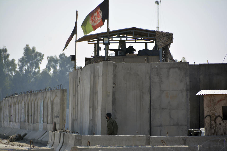 FILE - In this March 6, 2019 file photo, Afghan security personnel man a checkpoint at the airport after a suicide attack, in Jalalabad province, east of Kabul, Afghanistan. In a Thursday, March 28, 2019 report the Special Inspector General for Afghan Reconstruction, a U.S. watchdog, said that Afghanistan will remain dependent on international donors and foreign help even after a peace deal with the Taliban is reached. The report identified main high-risk areas including widespread insecurity. (AP Photo/Mohammad Anwar Danishyar)