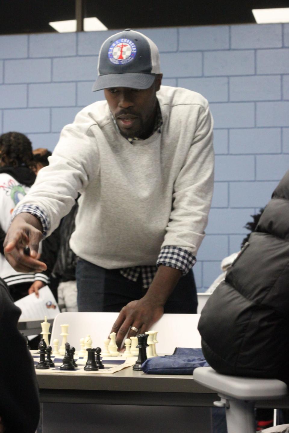 Vincent Spriggs of G.A.M.E. Changers teaches clients at the Shelby County Youth and Family Resource Center how to play chess Tuesday, Jan. 24, 2022.