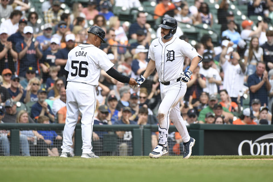 Detroit Tigers' Jake Rogers, right, is congratulated by third base coach Joey Cora after hitting a home run in the sixth inning of a baseball game against the Kansas City Royals, Sunday, April 28, 2024, in Detroit. (AP Photo/Jose Juarez)