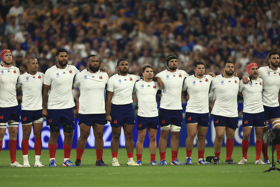 France's squad pay respect to the French national anthem during the Rugby World Cup Pool A match between France and New Zealand in Saint-Denis, north of Paris, Friday, Sept, 8, 2023. (AP Photo/Aurelien Morissard)