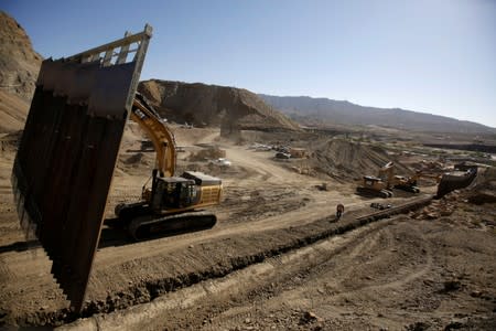 FILE PHOTO: Heavy machinery moves a bollard-type wall, to be placed along the border of private property using funds raised from a GoFundMe account, at Sunland Park, N.M., as seen from Ciudad Juarez