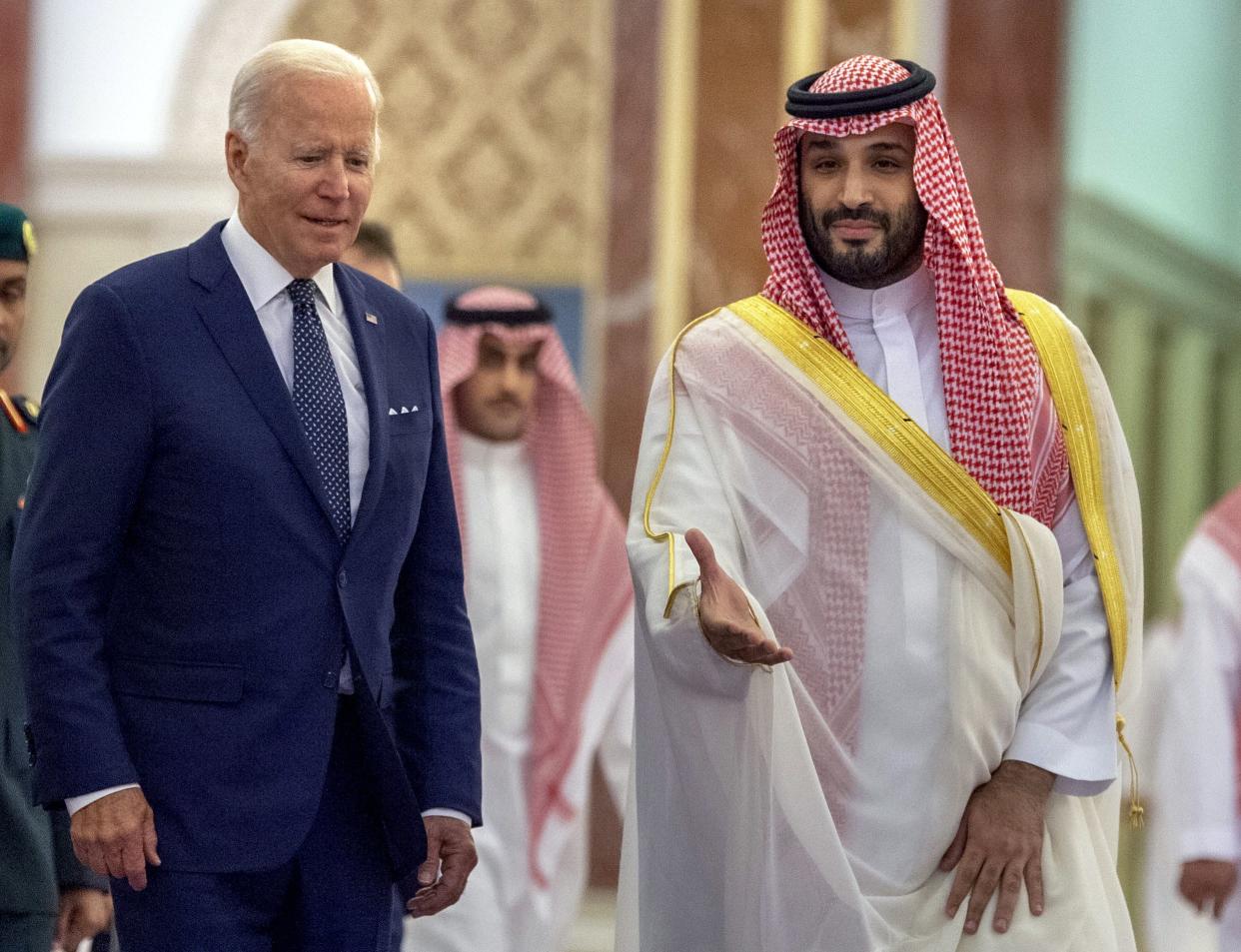 Saudi Crown Prince Mohammed bin Salman, right, welcomes President Joe Biden upon his arrival at Al-Salam palace in Jeddah, Saudi Arabia, Friday, July 15, 2022. 