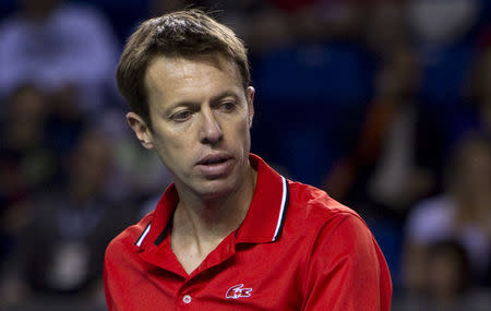 FILE PHOTO: Canada's Daniel Nestor looks on while facing Italy's Daniele Bracciali and Fabio Fognini during doubles match play at the second round of the Davis Cup tennis tournament in Vancouver, British Columbia April 6, 2013. REUTERS/Ben Nelms/File Photo