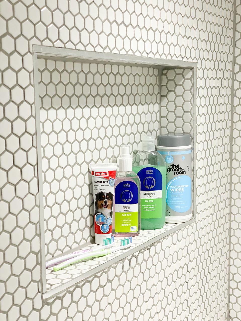 The impressive space has a recessed shelf for all their pooch pamper products. (@homestuffonly and Drench)