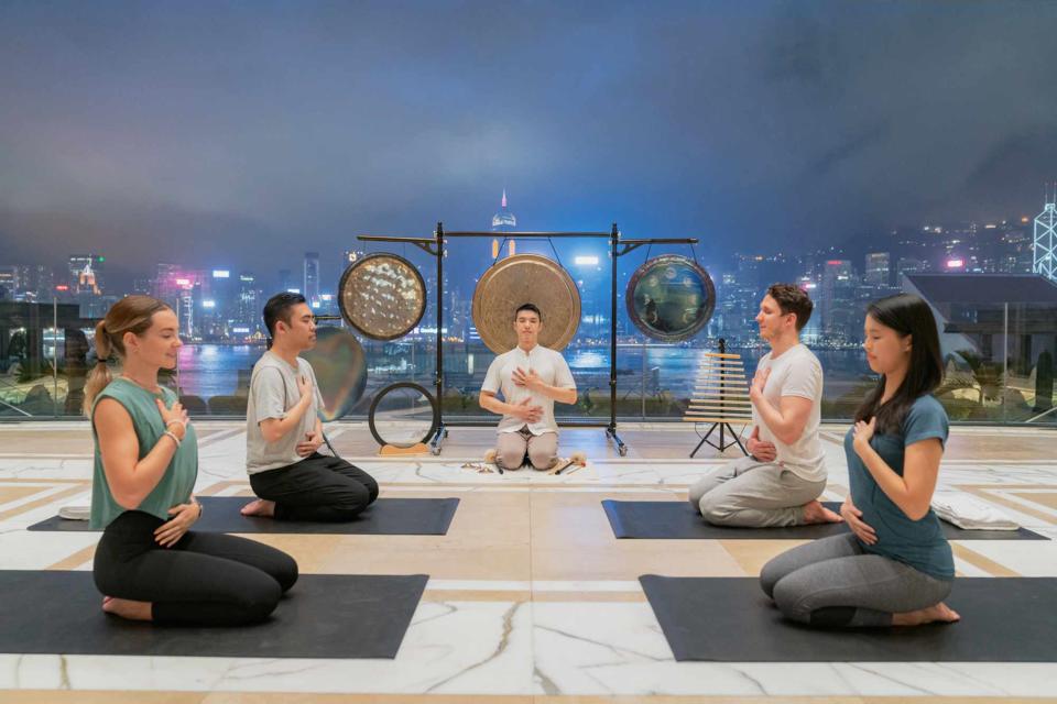 <p>Courtesy of The Peninsula Hotels</p> A wellness session with a view at the Peninsula Hong Kong.