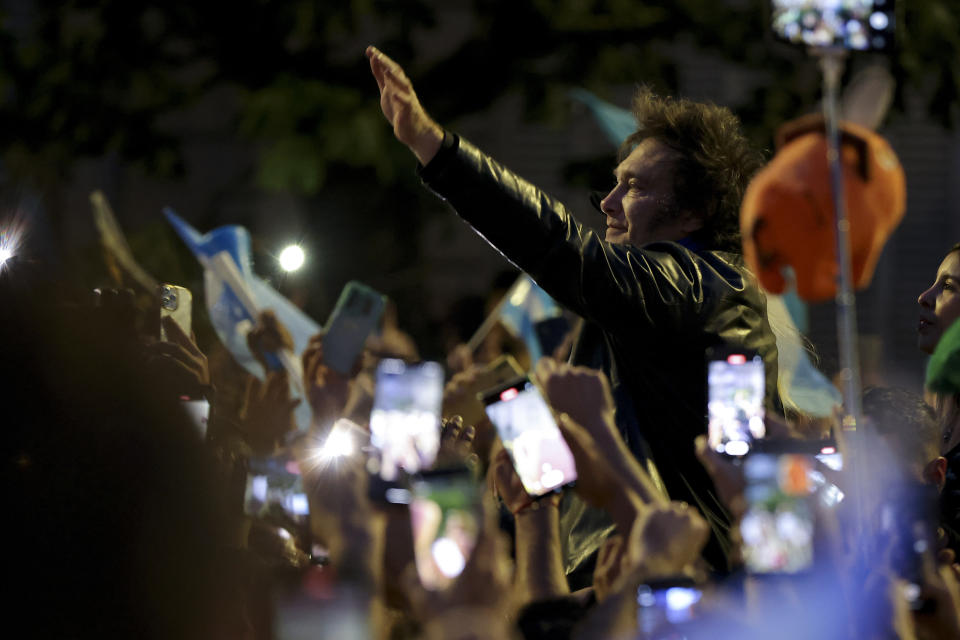 Javier Milei, Liberty Advances coalition presidential candidate, right, greets supporters during his closing campaign rally in Cordoba, Argentina, Thursday, Nov. 16, 2023. Milei will face Economy Minister Sergio Massa, the ruling party's candidate, in a runoff election on Nov. 19. (AP Photo/Nicolas Aguilera)