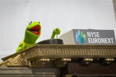 Muppet Kermit the Frog rings the opening bell at the New York Stock Exchange March 17, 2014. REUTERS/Brendan McDermid