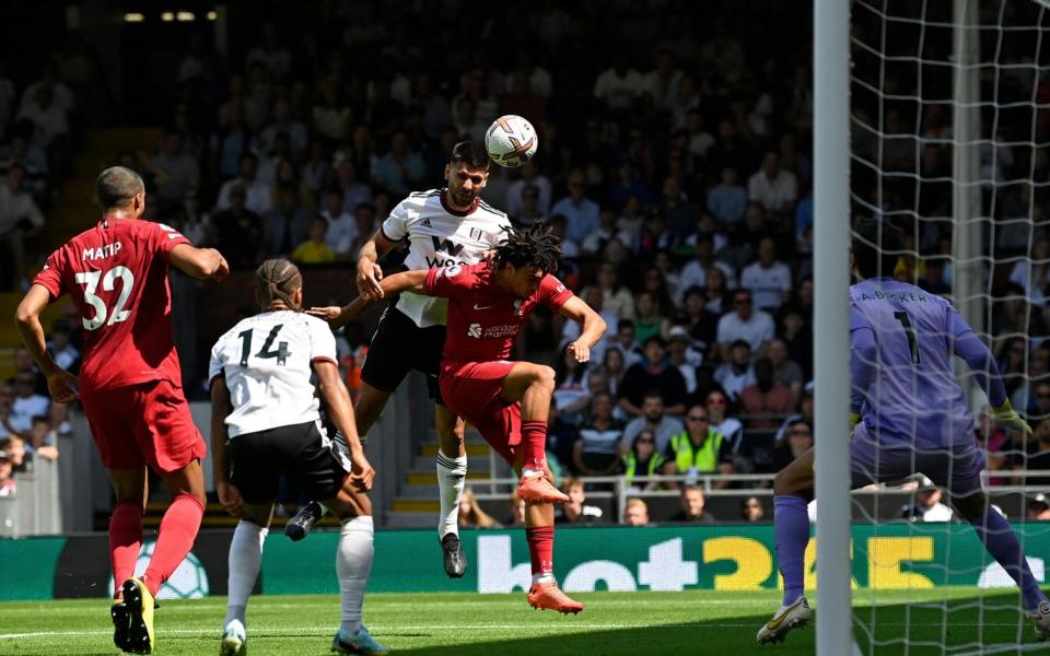 Fulham's Serbian striker Aleksandar Mitrovic (C) heads home the opening goal of the English Premier League football - AFP