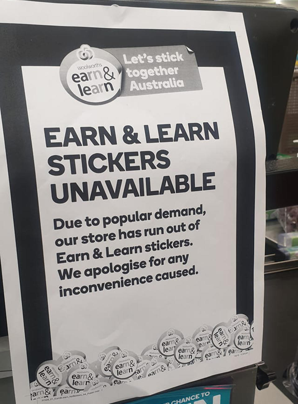 Pictured is a sign on a Woolworths register explaining the Earn & Learn stickers have run out before the promotion is due to finish.