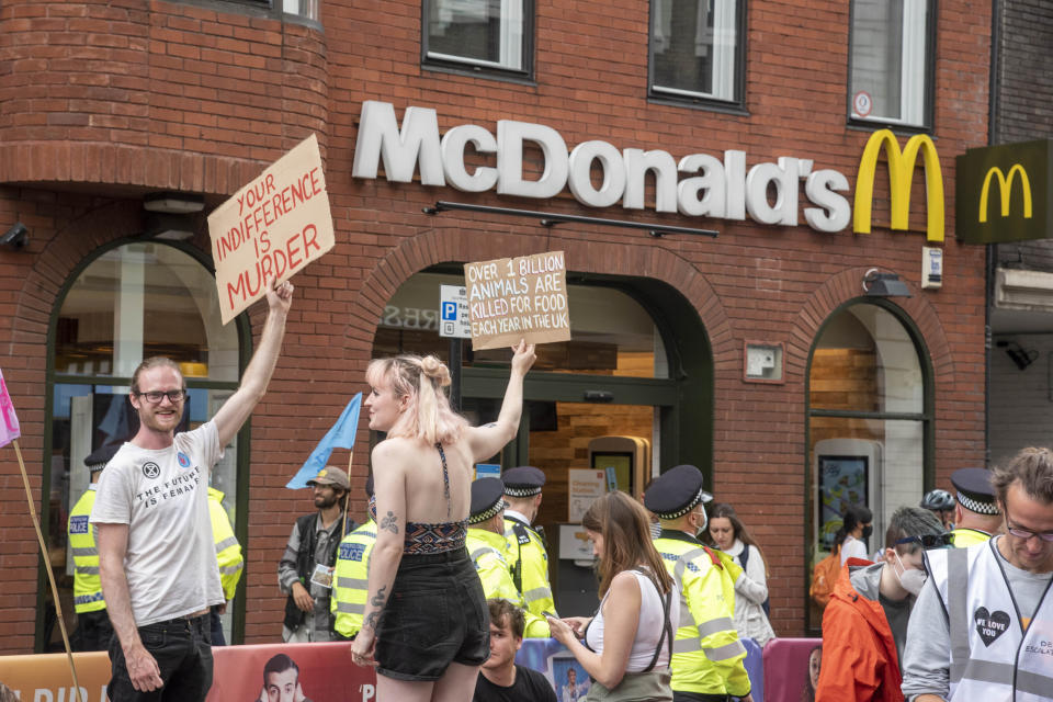 LONDON, UNITED KINGDOM - 2021/08/23: Animal Rebellion protesters hold placards outside a branch of McDonalds restaurant during the Extinction Rebellions day one of a two week demonstration in Central London.
Extinction Rebellion held a protest against climate change, global warming, which plans to target the root cause of the climate and ecological crisis and to demand the government divest from fossil fuel companies ahead of COP26 the 2021 United Nations Climate Change Conference. (Photo by Dave Rushen/SOPA Images/LightRocket via Getty Images)