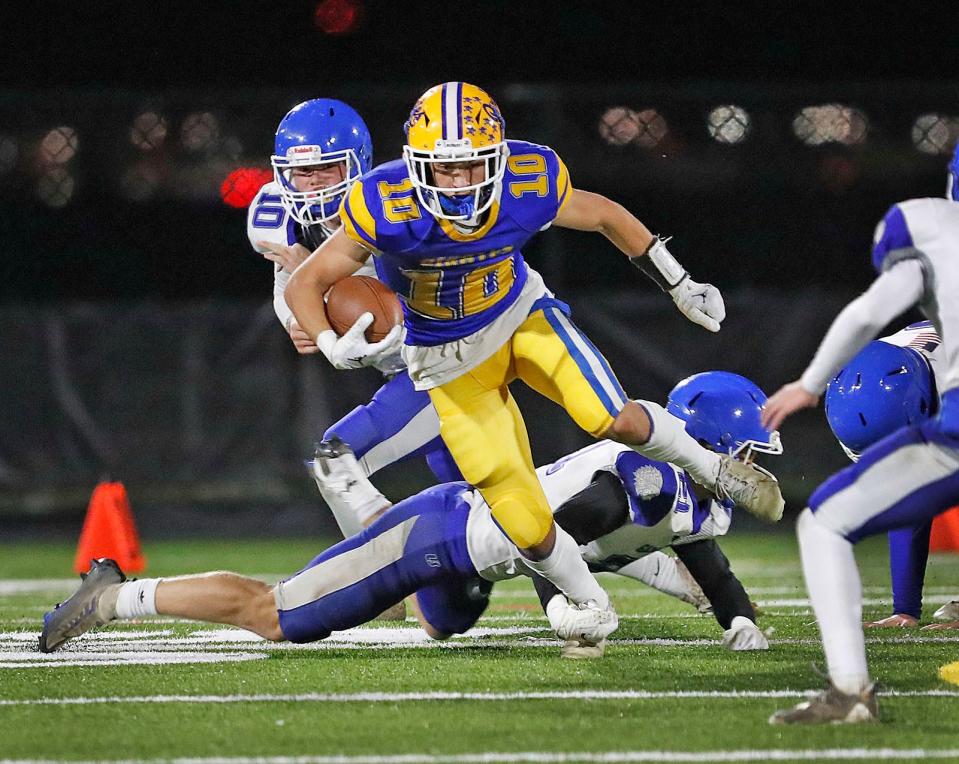 Wide receiver Nick Tiani takes a screen pass upfield.The Hull Pirates play their first round in the MIAA tournament against the Narragansett Warriors at home on Friday November 4, 2022.