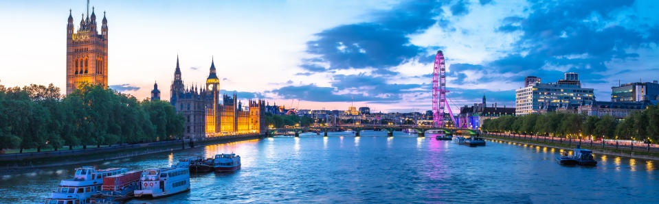 Bigh Ben and Thames riverfront sundown panoramic view in London, capital of United Kingdom