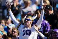 A Minnesota Vikings fan cheers during the second half of an NFL football game between the Carolina Panthers and the Minnesota Vikings, Sunday, Oct. 17, 2021, in Charlotte, N.C. (AP Photo/Jacob Kupferman)