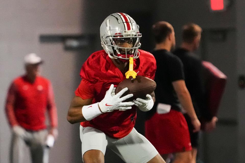 Mar 7, 2024; Columbus, OH, USA; Ohio State Buckeyes wide receiver Carnell Tate (17) returns a punt during spring football practice at the Woody Hayes Athletic Center.