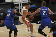 Atlanta Hawks guard Bogdan Bogdanovic (13) tries to get around Orlando Magic guard Gary Harris (14) and forward Moritz Wagner (21) in the first half of an NBA basketball game Thursday, May 13, 2021 in Atlanta. (AP Photo/Tami Chappel)