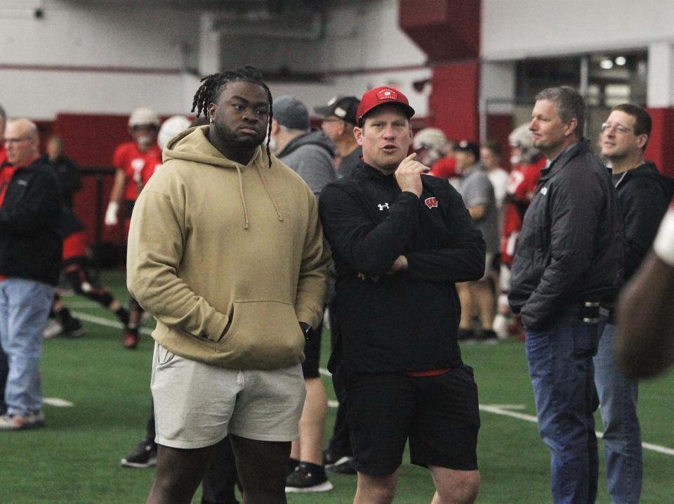 CJ West, a defensive tackle from Kent State who is in the transfer portal, talks with Wisconsin director of recruiting Pat Lambert during a recruiting visit to Badgers practice on Tuesday at the McClain Center in Madison.