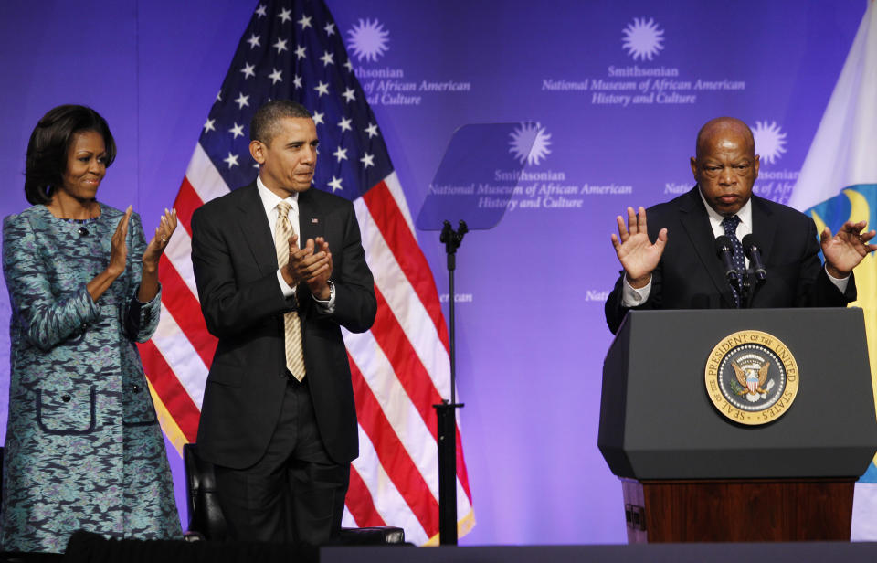 President Barack Obama and first lady Michelle Obama applaud as Rep. John Lewis, D-Ga., speaks at the groundbreaking for the Smithsonian National Museum of African American History and Culture in Washington on Feb. 22, 2012. (Photo: Charles Dharapak/AP)
