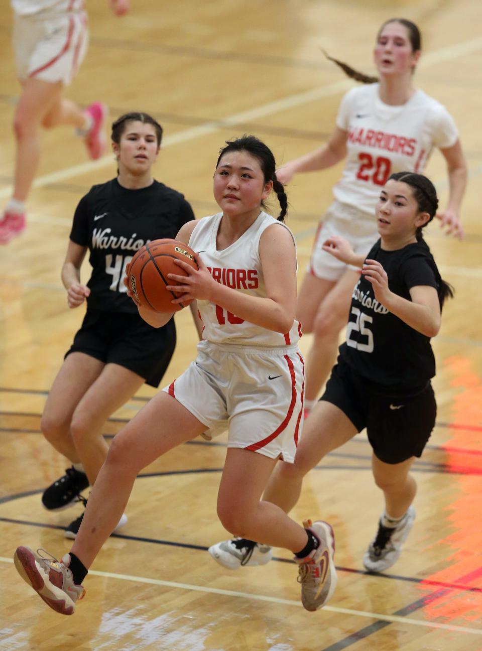 Crosspoint’s Momoyo Iwata (10) drives to the basket for a layup during their 53-29 win over Almira Coulee Hartline at Tacoma Community College on Saturday, Feb. 24, 2024.