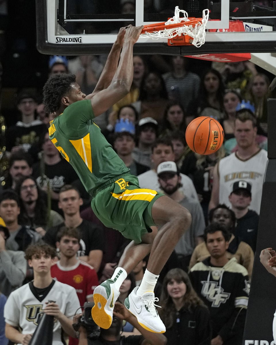 Baylor forward Josh Ojianwuna makes an uncontested dunk against Central Florida during the second half of an NCAA college basketball game, Wednesday, Jan. 31, 2024, in Orlando, Fla. (AP Photo/John Raoux)