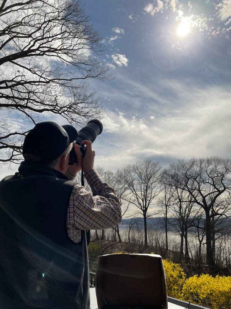 Tom Goff of Sleepy Hollow taking photos of the total solar eclipse on April 8, 2024, at Philipse Manor Riverwalk in Sleepy Hollow.
