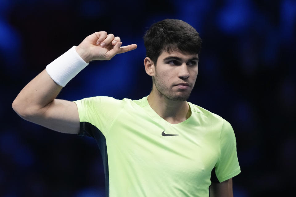 FILE - Spain's Carlos Alcaraz reacts during his singles semifinal tennis match against Serbia's Novak Djokovic at the ATP World Tour Finals at the Pala Alpitour, in Turin, Italy, Saturday, Nov. 18, 2023. Alcarraz is one of the players to watch at the Australian Open. The year's first Grand Slam tennis tournament is scheduled to start at Melbourne Park on Sunday, Jan. 14. (AP Photo/Antonio Calanni, File)