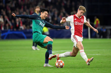 FILE PHOTO: Soccer Football - Champions League Semi Final Second Leg - Ajax Amsterdam v Tottenham Hotspur - Johan Cruijff Arena, Amsterdam, Netherlands - May 8, 2019 Tottenham's Son Heung-min in action with Ajax's Frenkie de Jong REUTERS/Piroschka Van De Wouw/File Photo