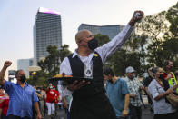 Jose Rivera, center, chants with other members of the Culinary Workers Union to bring attention to the 21,000 members who are still not back to work since the pandemic began, during a march, Friday, Sept. 24, 2021 on the Strip in Las Vegas. (Rachel Aston/Las Vegas Review-Journal via AP)