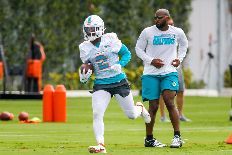 Miami Dolphins running back Chase Edmonds (2) runs with the football during a minicamp workout at Baptist Health Training Complex.