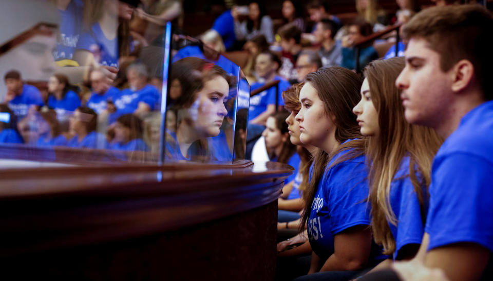 Students look on above the Florida Senate