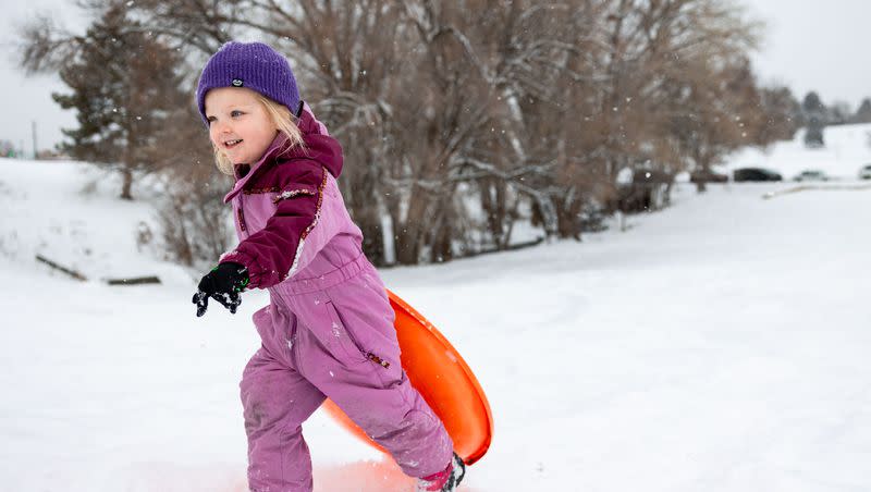 Grace, 3, walks her sled back up a hill at Sugar House Park in Salt Lake City on Sunday, Jan. 7, 2024. Winter storms hit the Wasatch Front over the weekend.