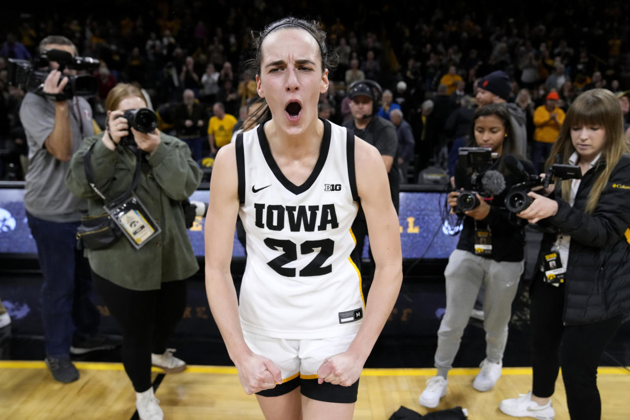 Iowa guard Caitlin Clark celebrates after a win over in-state rival Iowa State on Dec. 7, 2022, in Iowa City, Iowa. (AP Photo/Charlie Neibergall)