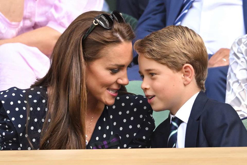 <p>Karwai Tang/WireImage</p> Kate Middleton and Prince George chat at Wimbledon in July 2022