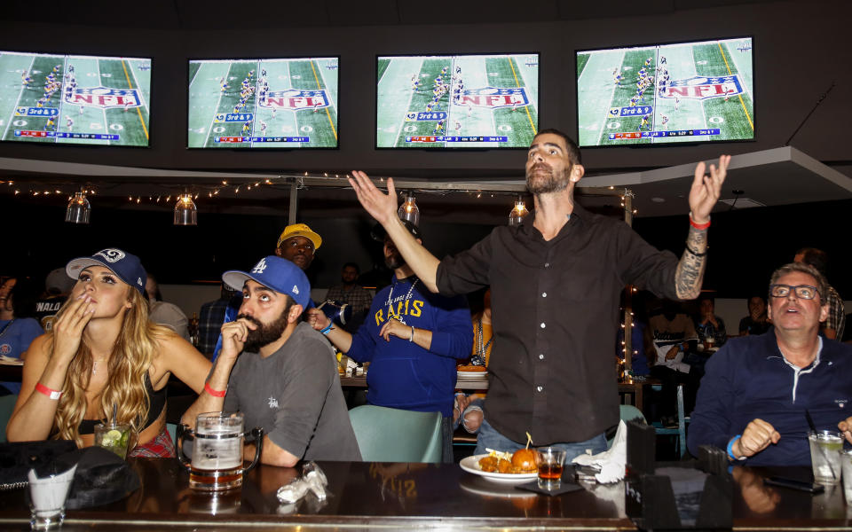 Rams fans react during a viewing party for last season's Super Bowl. (AP)