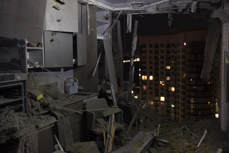 A damaged apartment is seen in Kyiv, Ukraine, Thursday, July 13, 2023, following Russia's air attacks targeting the capital city. (AP Photo/Jae C. Hong)