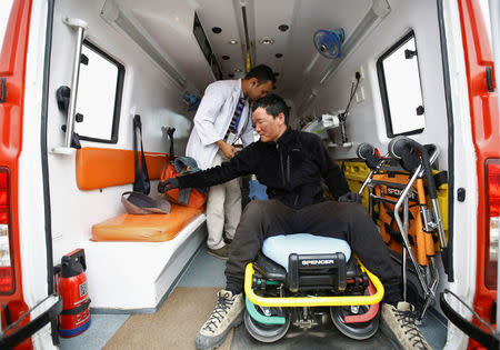 Chinese climber Liu Lei, who says he successfully climbed Mount Everest, gets a checkup inside an ambulance after returning from Mount Everest summit in Kathmandu, Nepal, May 24, 2016. REUTERS/Navesh Chitrakar