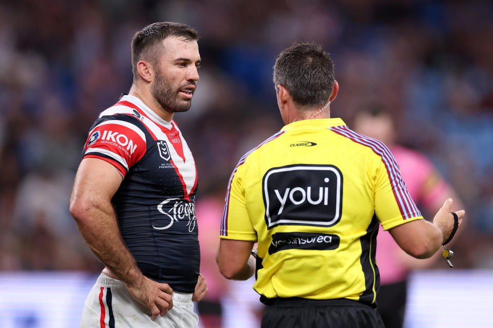 James Tedesco speaks with referee Adam Gee.