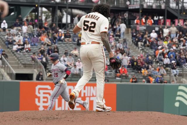 Mitch Haniger of the San Francisco Giants rounds the bases after