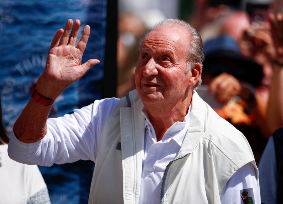 Former Spanish King Juan Carlos waves as he arrives at Sanxenxo Sailing Club to take part in a sailing regatta in Sanxenxo, Spain May 20, 2022. REUTERS/Pedro Nunes